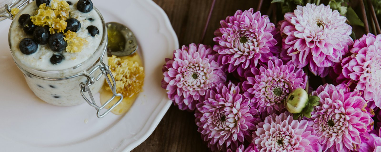 Pink dahlias beside a breakfast tray