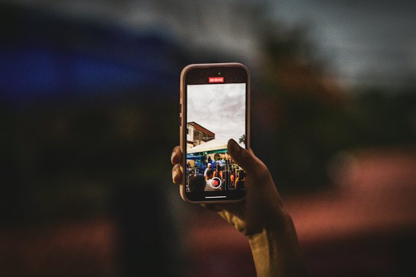 A phone held up taking a photo