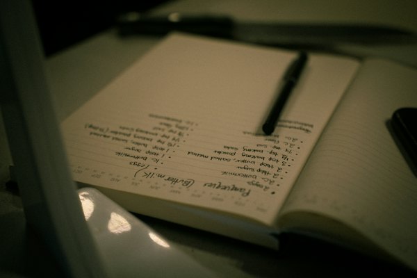 Handwritten notes in an open notebook